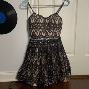 Black  and beige padded peacock dress